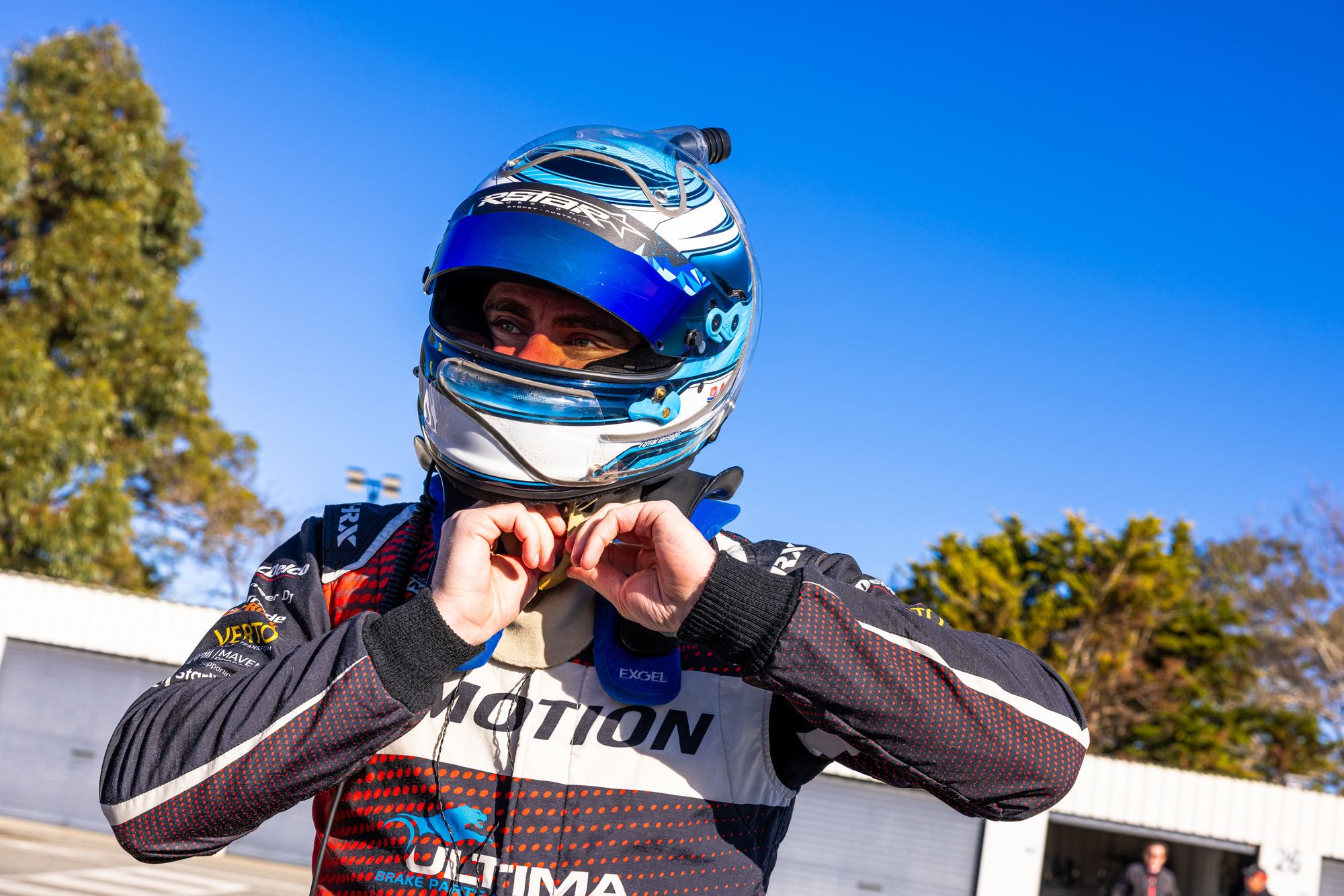Aaron fastening his helmet before a session